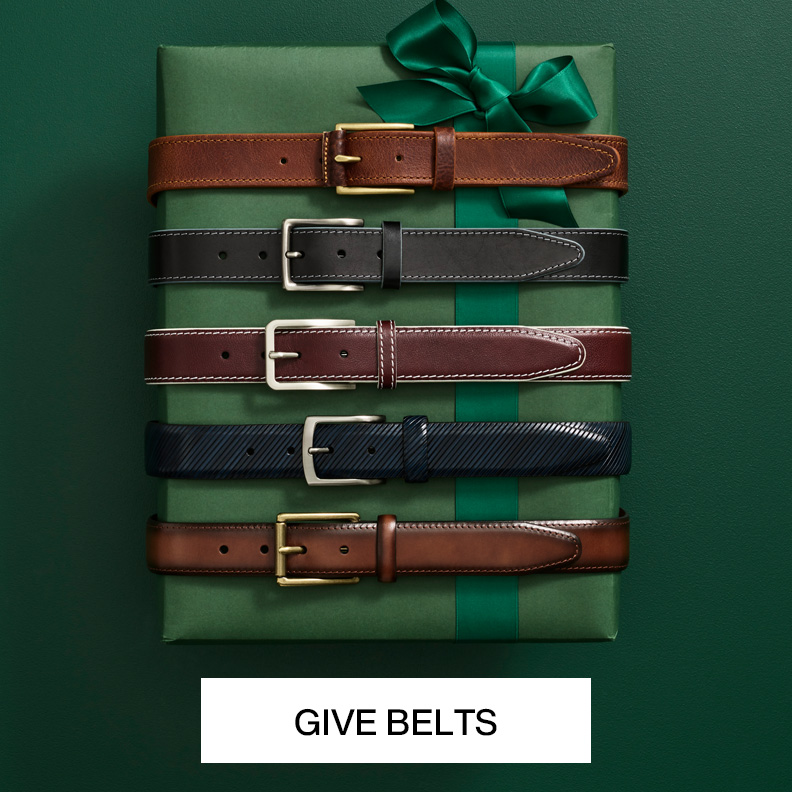 A wrapped green present box with 5 belts wrapped around it. 