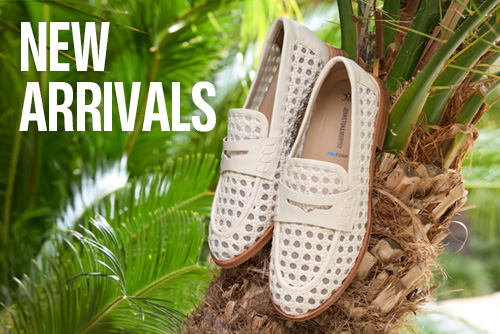 Creative picture of womens loafers in a palm tree