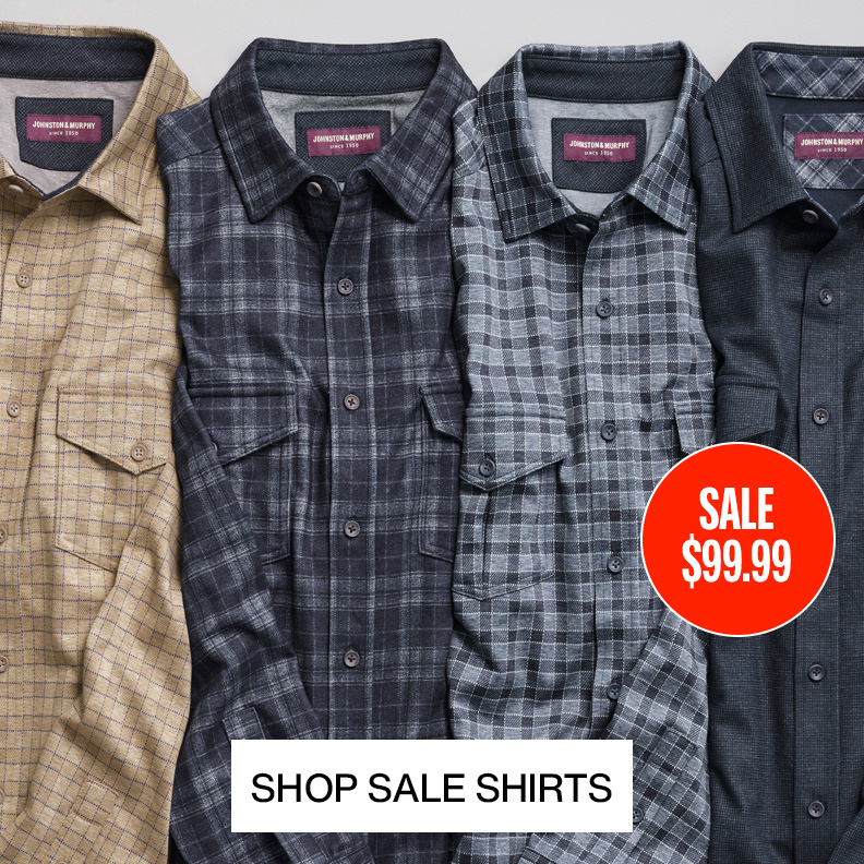 Flatlay of four men's shirts lined up in a row. The shirt colors are tan, dark blue, blue and grey, and navy with a sale message sticker overtop one of the shirts.